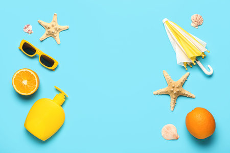 Composition with beach accessories, ripe oranges and starfishes on color background