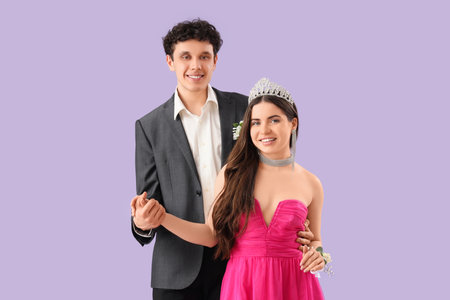 Pretty prom couple on lilac backgroundの写真素材