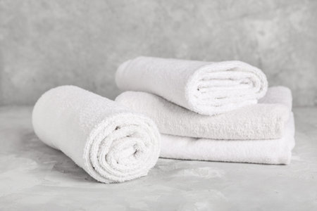 Set of clean towels on grunge backgroundの写真素材