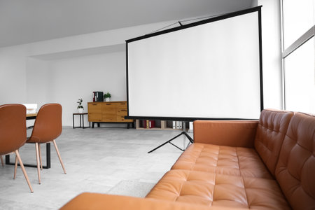 Interior of conference hall with projector screen and sofaの写真素材