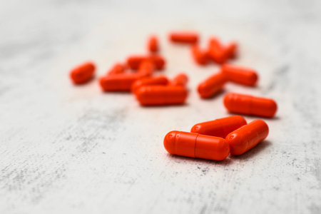 Turmeric pills on white background