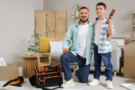 Father with his son and assembly tools at home