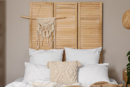 Wooden folding screen with tapestry in bedroom interior