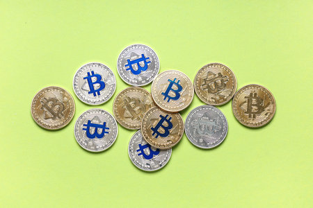 Many bitcoins on green background