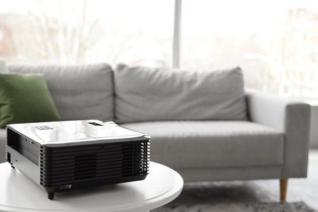 Modern projector on white table in living room, closeupの写真素材