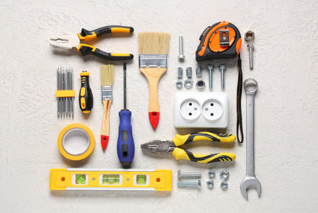 Arrangement of construction tools on white grunge background