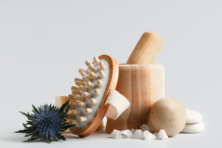 Set of spa accessories, sea salt and plant on gray backgroundの写真素材