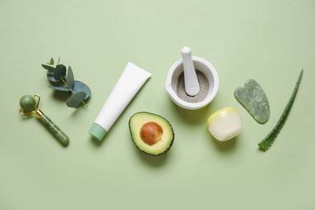 Composition with natural cosmetic products, ingredients and facial massage tools on color backgroundの写真素材