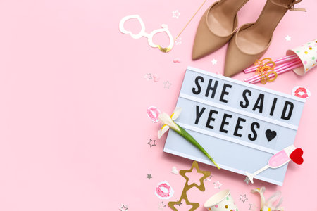 Board with text SHE SAID YES and decor for Hen Party on pink backgroundの写真素材