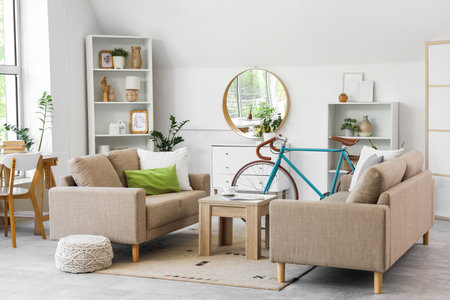 Interior of living room with bicycle, sofa and shelf unitsの写真素材