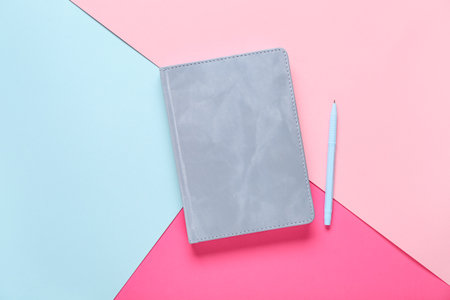 Gray notebook with pen on color background, closeupの写真素材