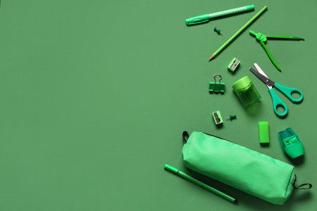 Composition with different school stationery on green backgroundの写真素材