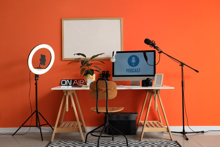 Interior of podcaster's studio with workplace and blank frameの写真素材
