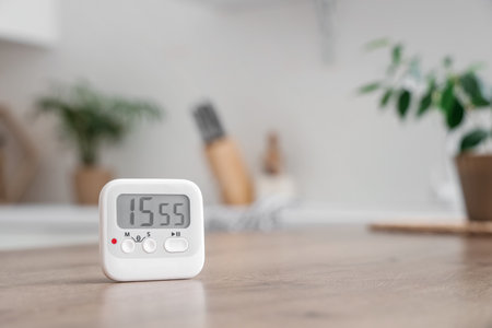 Kitchen timer on table in room, closeupの写真素材
