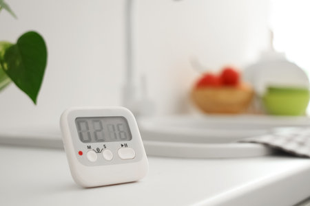 Kitchen timer on counter near sink in room, closeupの写真素材
