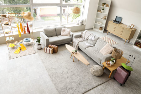 Interior of living room with swimsuits and sofas