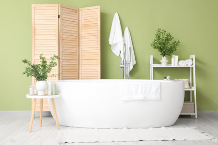 Interior of bathroom with green branchesの写真素材