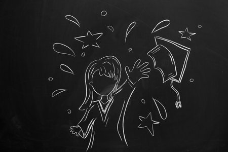Drawn female graduate with mortar board on blackboardの写真素材