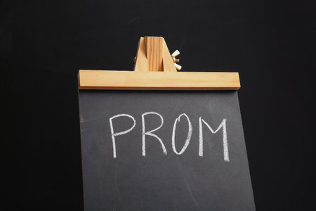 Chalkboard with word PROM on dark backgroundの写真素材