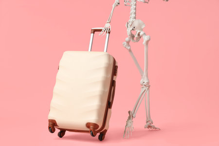Human skeleton with suitcase on pink background, back view. Travel conceptの写真素材