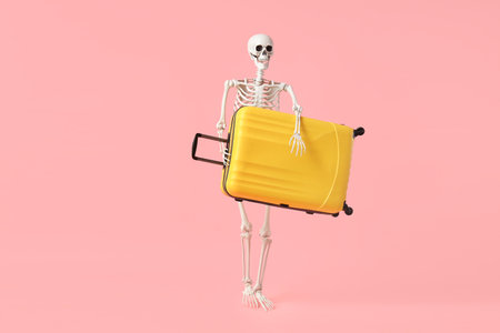 Human skeleton with suitcase on pink background. Travel conceptの写真素材