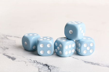 Blue dices on light background