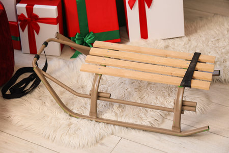 Sled with Christmas presents in living room