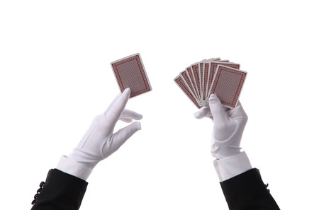 Male magician's hands with playing cards on white background