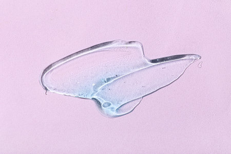 Sample of cosmetic gel on pink background, closeup