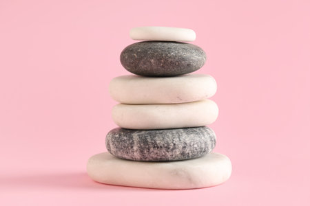 Stack of pebbles on pink background. Zen conceptの写真素材