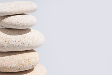 Stack of pebbles on gray background, closeup. Zen conceptの写真素材
