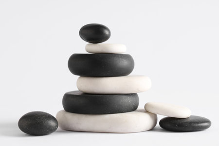 Stack of pebbles on light background. Zen conceptの写真素材