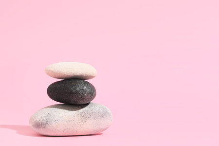 Stack of pebbles on pink background. Zen conceptの写真素材