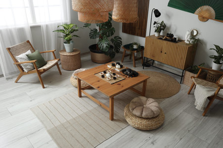 Chinese tea ceremony set on table in interior of living roomの写真素材