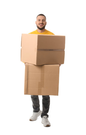 Young man carrying cardboard boxes on white backgroundの写真素材