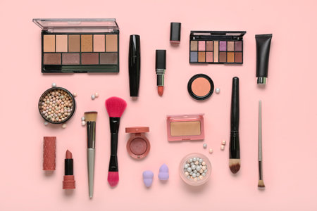 Composition with different makeup brushes and cosmetic products on pink backgroundの写真素材