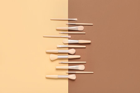 Set of different makeup brushes on color backgroundの写真素材