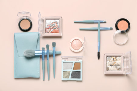 Composition with makeup brushes, case and cosmetic products on pink backgroundの写真素材