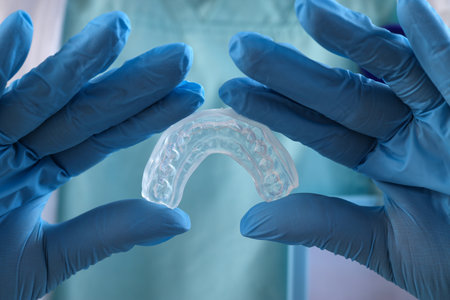Female dentist with occlusal splint, closeupの写真素材