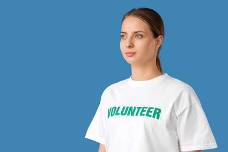 Female volunteer on blue backgroundの写真素材