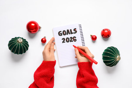 Woman making to do list for 2026 year on white backgroundの写真素材