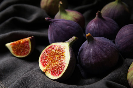 Fresh ripe figs on black napkin, closeupの写真素材