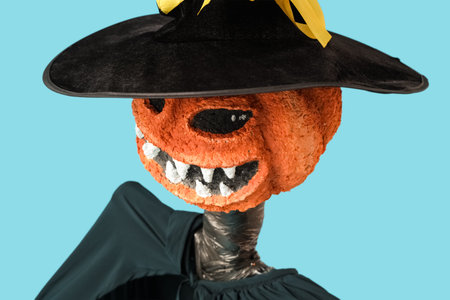 Spooky Halloween monster on blue background, closeup