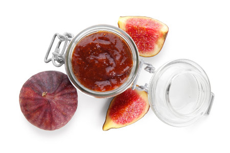 Glass jar of tasty fig jam isolated on white background, closeupの写真素材