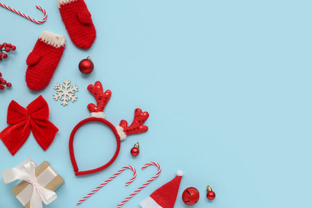 Christmas reindeer antlers headband with gift and decor on blue backgroundの写真素材