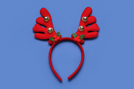 Christmas reindeer antlers headband on blue background