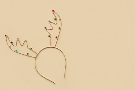 Christmas reindeer antlers headband on beige backgroundの写真素材