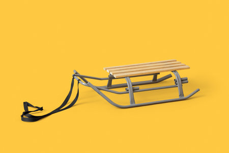 Empty sled on yellow backgroundの写真素材