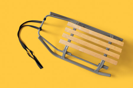 Empty sled on yellow backgroundの写真素材