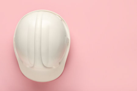 Hardhat on pink background, top viewの写真素材